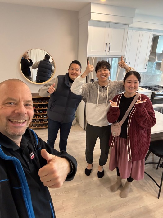 Shane Ballard with clients after an inspection