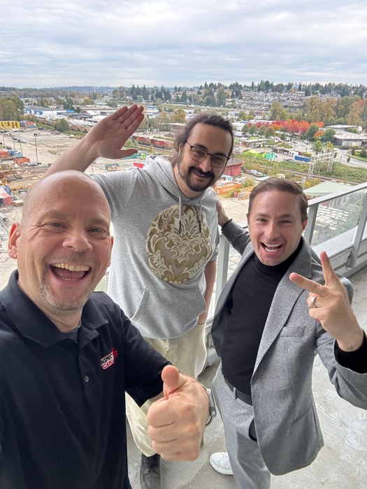 Shane Ballard with a client on a condo balcony