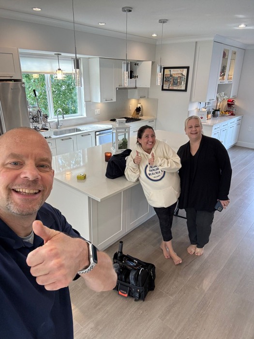 Shane Ballard with clients in their new kitchen