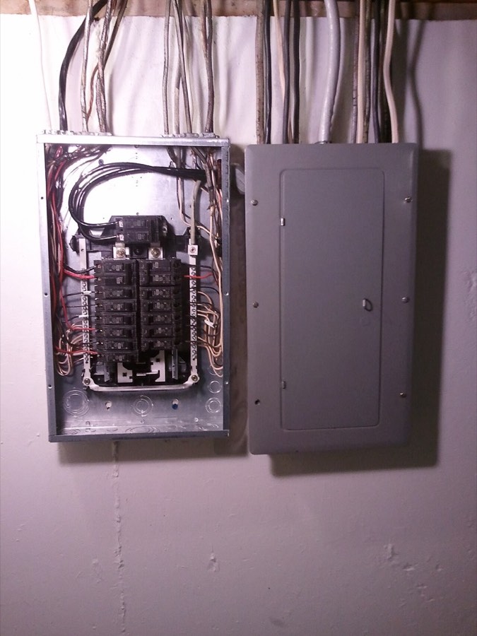Main electrical panel and subpanel with the cover removed